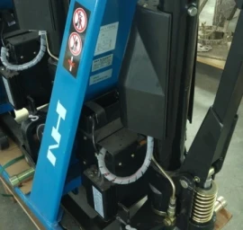 21-32-111 Elektrinis - hidraulinis aukšto pakėlimo padėklų vežimėlis NH SLX 1000E