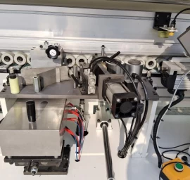 20-09-509 Kraštų užklijavimo staklės WOODLAND MACHINERY (su lankstų gręžimo funkcija)  (naujos)