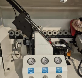 20-09-509 Kraštų užklijavimo staklės WOODLAND MACHINERY (su lankstų gręžimo funkcija)  (naujos)