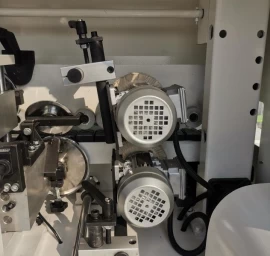 20-09-509 Kraštų užklijavimo staklės WOODLAND MACHINERY (su lankstų gręžimo funkcija)  (naujos)